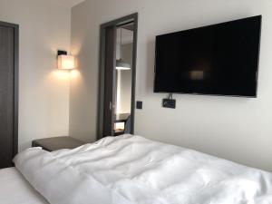 Postel nebo postele na pokoji v ubytování Hotel Smartino
