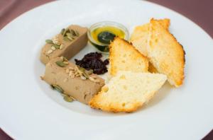 a plate of food with bread and toast at Elinor Complex in Haskovo