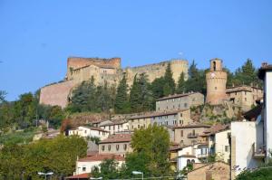 a town with castles on top of a hill at Hotel Prati in Castrocaro Terme