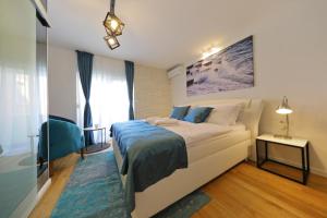 a small bedroom with a bed and a window at La Dolce Vita da Zara - Luxury Rooms in Zadar