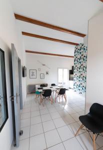 a living room with a table and chairs at Vista Mare in Porticcio