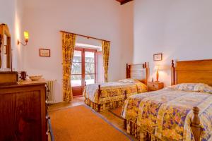 Ένα ή περισσότερα κρεβάτια σε δωμάτιο στο Monte da Lapa