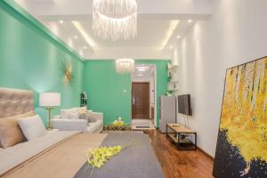 a living room with a large bed and a couch at Chengdu Qingyang·Lihua Street· Locals Apartment 00116030 in Chengdu