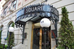 a store front with a sign for the hotel square hotel at Washington Square Hotel in New York