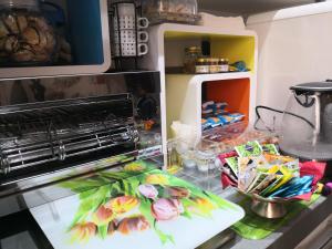 A kitchen or kitchenette at EcoHouse & BioVeg Café