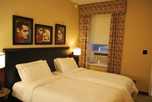 Postel nebo postele na pokoji v ubytování Washington Square Hotel