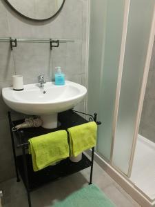 a bathroom with a sink and a mirror at Apartment in Salerno Centro in Salerno