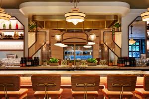 a bar at a restaurant with chairs and a counter at Eaton DC in Washington, D.C.