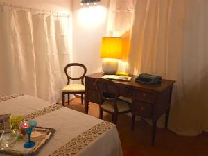 A bed or beds in a room at La Casa Di Ago