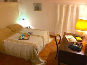 A bed or beds in a room at La Casa Di Ago