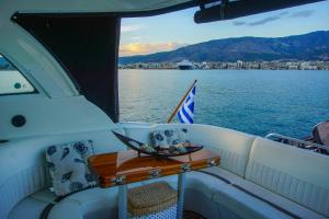 a table on the back of a boat on the water at THEMIs MCPY in Skiathos