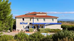 a hotel building with a sign that reads the hotel at Audotel in Carcassonne