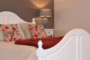 a white bed with pillows and a red blanket at La Longere De Cabanes in Cabanès +41 photos