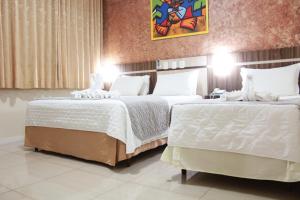 Postel nebo postele na pokoji v ubytování Hotel Real