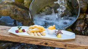 a plate of food sitting on a table with food at Krumbacherhof in Krumbach Markt