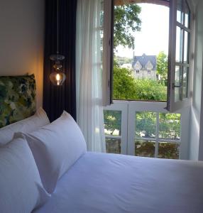 Postel nebo postele na pokoji v ubytování Hôtel Ginkgo - SPA Biloba