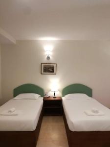 En eller flere senge i et værelse på Mamaungpaa Hill resort