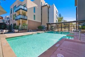 a swimming pool in front of a building at Global Luxury Suites at Downtown Mountain View in Mountain View