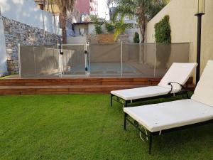 Um jardim em Villaggio Hotel Boutique