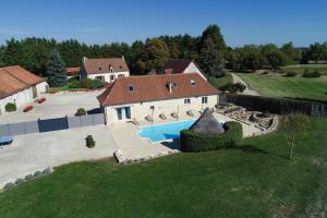 an aerial view of a house with a swimming pool at Le Boursignoux in La Trimouille