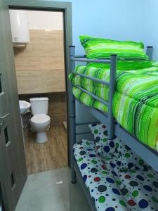 a bedroom with a bunk bed with a toilet at Regim Hotelier Pietonală in Oradea