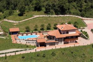 an aerial view of a house with a swimming pool at Resort San Pellegrino Terme in San Pellegrino Terme