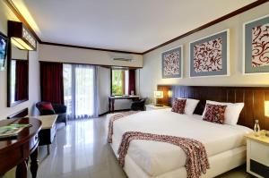 Postel nebo postele na pokoji v ubytování Bali Garden Beach Resort