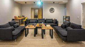 a living room with couches and a coffee table at Jacuzzi Party & Event Space up to 40 in Krakow