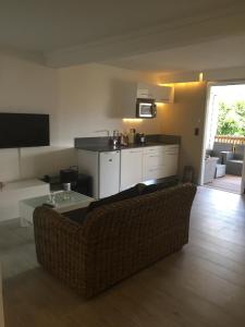 a living room with a couch and a table at Studio Montgérald in Fort-de-France