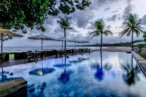 
a beach scene with a large pool of water at Bali Garden Beach Resort in Kuta
