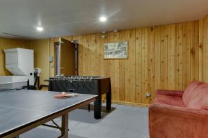 a room with a ping pong table and a chair at Pioneer Condominiums in Bogus Basin