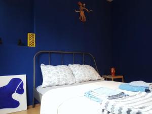 Postel nebo postele na pokoji v ubytování Blue Dreams Apartment