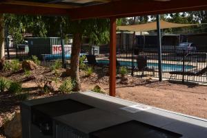 a view of a patio area with a view of the water at Yarrawonga Riverlands Tourist Park in Yarrawonga