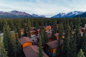 an aerial view of a resort with mountains in the background at Denali Cabins in McKinley Park
