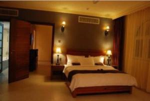 Ένα ή περισσότερα κρεβάτια σε δωμάτιο στο La Rosa Hotel By Brother International