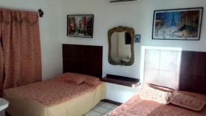 Postel nebo postele na pokoji v ubytování hotel quinta sierra