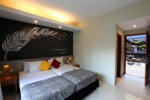 Tempat tidur dalam kamar di Hotel Sriti Magelang