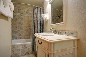 a bathroom with a sink and a shower at Mount Meeker 26B Condo in Estes Park