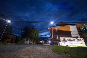 two lights on top of a building at night at Mae Faek Villas in San Sai