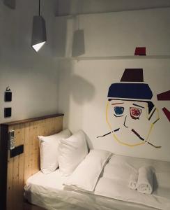 Postel nebo postele na pokoji v ubytování Just Inn Xin Yi 正旅館 信義