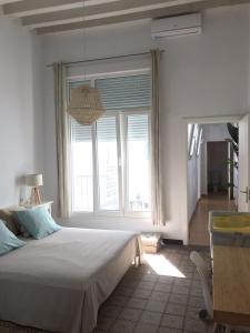 Łóżko lub łóżka w pokoju w obiekcie Veedor 12