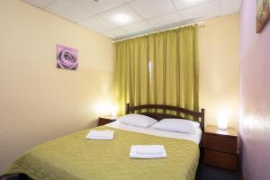  Кровать или кровати в номере Мини-отель Ботанический 