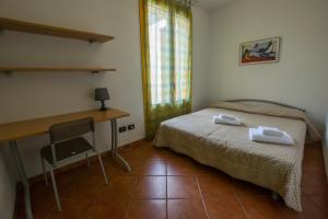 Postel nebo postele na pokoji v ubytování Residence Corso Monferrato
