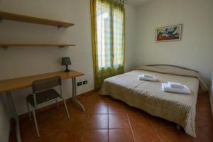 Tempat tidur dalam kamar di Residence Corso Monferrato