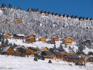 a group of houses on a snow covered mountain at Chez Maguy Chambres d'hôtes et appartements in Les Angles
