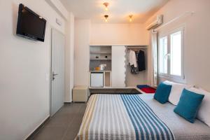TV a/nebo společenská místnost v ubytování Afrodete Hotel