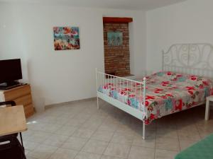 Posteľ alebo postele v izbe v ubytovaní Guesthouse Totićevi