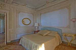 A bed or beds in a room at Villa Camaiore by PosarelliVillas