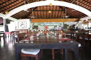 a large dining room with a large table and chairs at Talalla Retreat in Talalla South