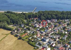 an aerial view of a house with a red circle at Haus Grete Wohnung 12 in Ostseebad Koserow